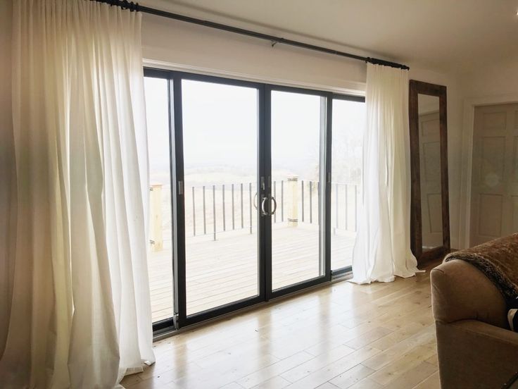 an open living room with sliding glass doors