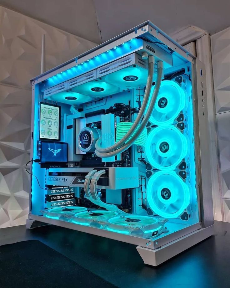 the inside of a computer case is lit up with blue lights