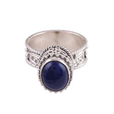 A delicate blue stone of lapis lazuli crowns this Indian single stone ring. Designed by Pawanesh Gupta the ring is handcrafted of sterling silver with bubble wire and rope motifs around the crown and band. Elegant Silver Sapphire Ring With Natural Stones, Sapphire Lapis Lazuli Ring Jewelry, Elegant Lapis Lazuli Ring Jewelry, Oval Lapis Lazuli Silver Jewelry, Oval Silver Lapis Lazuli Jewelry, Lapis Lazuli Gemstone Ring Jewelry, Elegant Lapis Lazuli Oval Cabochon Jewelry, Silver Jewelry With Oval Lapis Lazuli, Sapphire Jewelry With Silver Cabochon