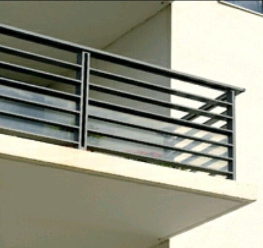 an apartment building with a balcony and balconies