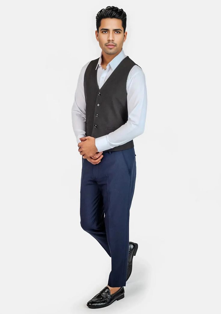 This Midnight Black Vest is designed with stretch cotton for comfort in classic black that is timeless in style. Level up your two piece black stretch suit with this custom made vest for a three piece look that is sure to impress. Fitted Sleeveless Blazer For Office, Elegant Black Cotton Blazer, Fitted Black Suit With Vest, Fitted Cotton Vest For Workwear, Black Sleeveless Suit With Vest, Classic Fitted Vest For Office Wear, Black Suits With Vest For Formal Occasions, Classic Black Suits With Vest, Classic Black Suit With Vest