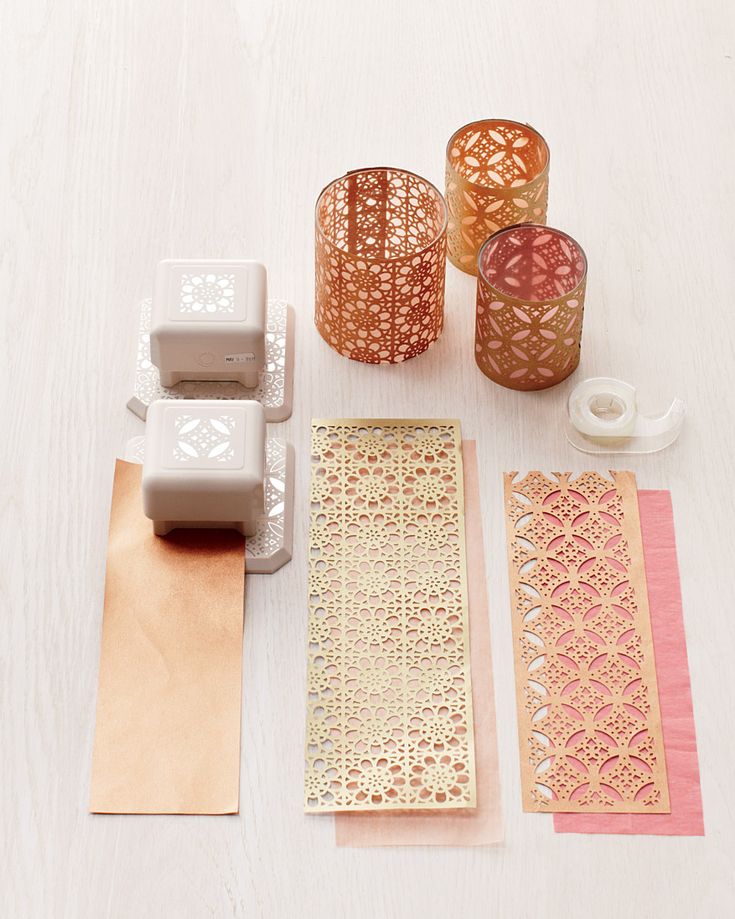 several different types of decorative items on a white table with tape, scissors and other crafting supplies