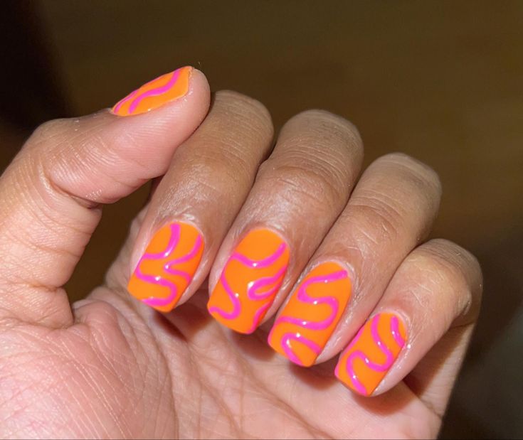 Orange And Pink Nails Swirls, Orange Pink Nail Designs, Spring Nails Orange And Pink, Neon Squiggle Nails, Pink And Orange Manicure, Almond Nails Orange And Pink, Orange Squiggle Nails, Orange Pink Nail Art, Funky Holiday Nails