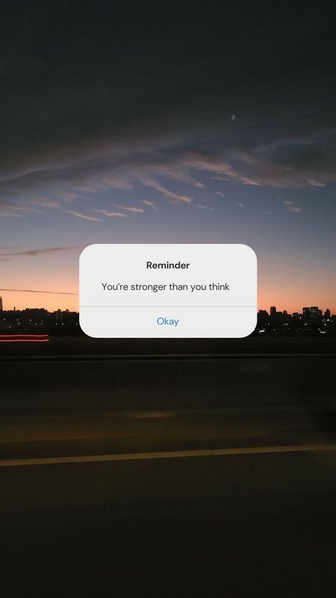 an iphone screen with the message reminder you're stronger than you think