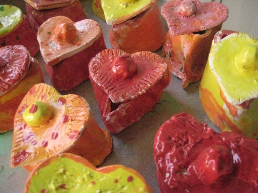 some heart shaped fruits are sitting on a table with other fruit in the shape of hearts