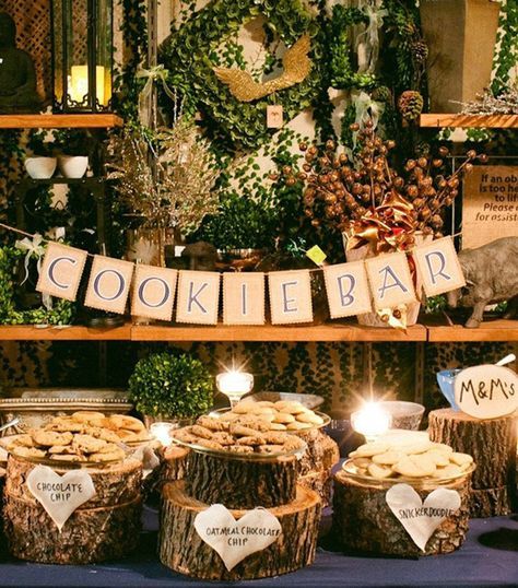 there are many cookies on display in the store with lights and decorations around them that say cookie bar