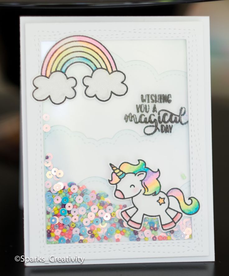 a card with a unicorn and rainbow on it