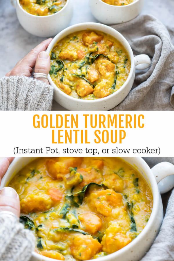 two bowls filled with golden turmic lentil soup and topped with spinach