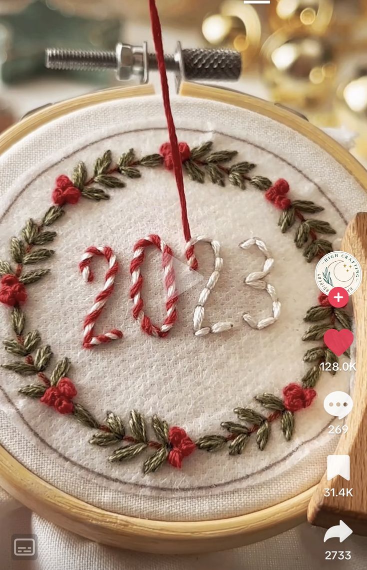 the embroidery is decorated with candy canes and greenery