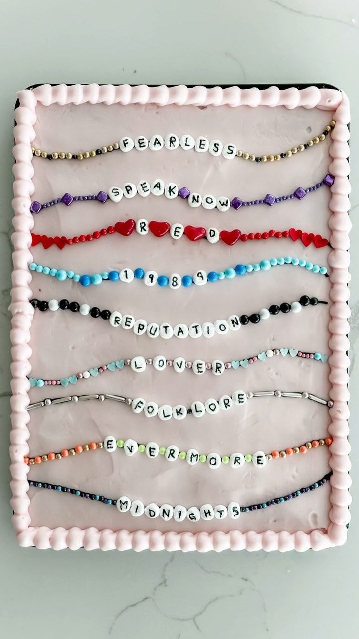 a white tray with beads and words on it