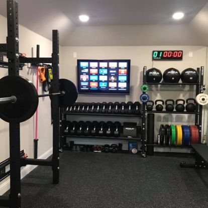 a home gym with weight machines, barbells and other equipment