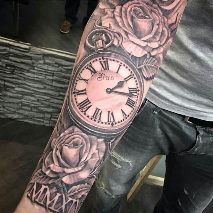 a man with a clock and roses tattoo on his arm