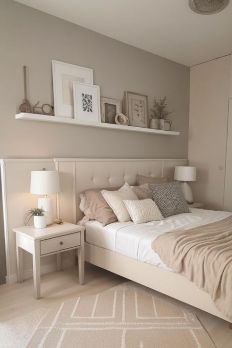 a bedroom with a bed, nightstands and pictures on the wall