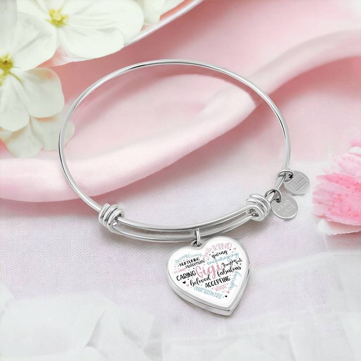 Gigi heart bangle bracelet with option engraving. The perfect gift for Gigi on Mothers Day, Christmas, Birthdays, or just because. Purchase This Best-seller and We Guarantee It Will Exceed Your Highest Expectations! This Jewelry Item Is the Perfect Keepsake! Whether for Yourself or a Loved One. ➜ If the custom engraving option is available, engrave onto the back of the pendant your loved one's name, your wedding date, an anniversary, or anything else you want to remember and keep you close to he Heart-shaped Stainless Steel Bracelet For Mother's Day, Adjustable Stainless Steel Heart Bracelet As Gift, Silver Heart Bracelet For Best Friend On Valentine's Day, Silver Heart Bracelet For Best Friend On Mother's Day, Heart-shaped Silver Bracelets For Best Friend Gift, Personalized Silver Heart Bracelet In Stainless Steel, Silver Heart Bracelets For Best Friend Gift, Meaningful Heart-shaped Bracelets For Mother's Day, Meaningful Heart Bracelets For Mother's Day