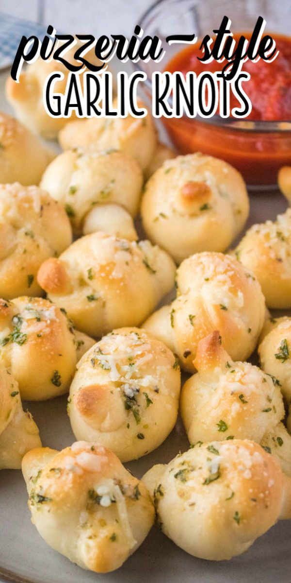 small garlic knots on a plate with dipping sauce in the background and text overlay that reads, pizzeria - style garlic knots