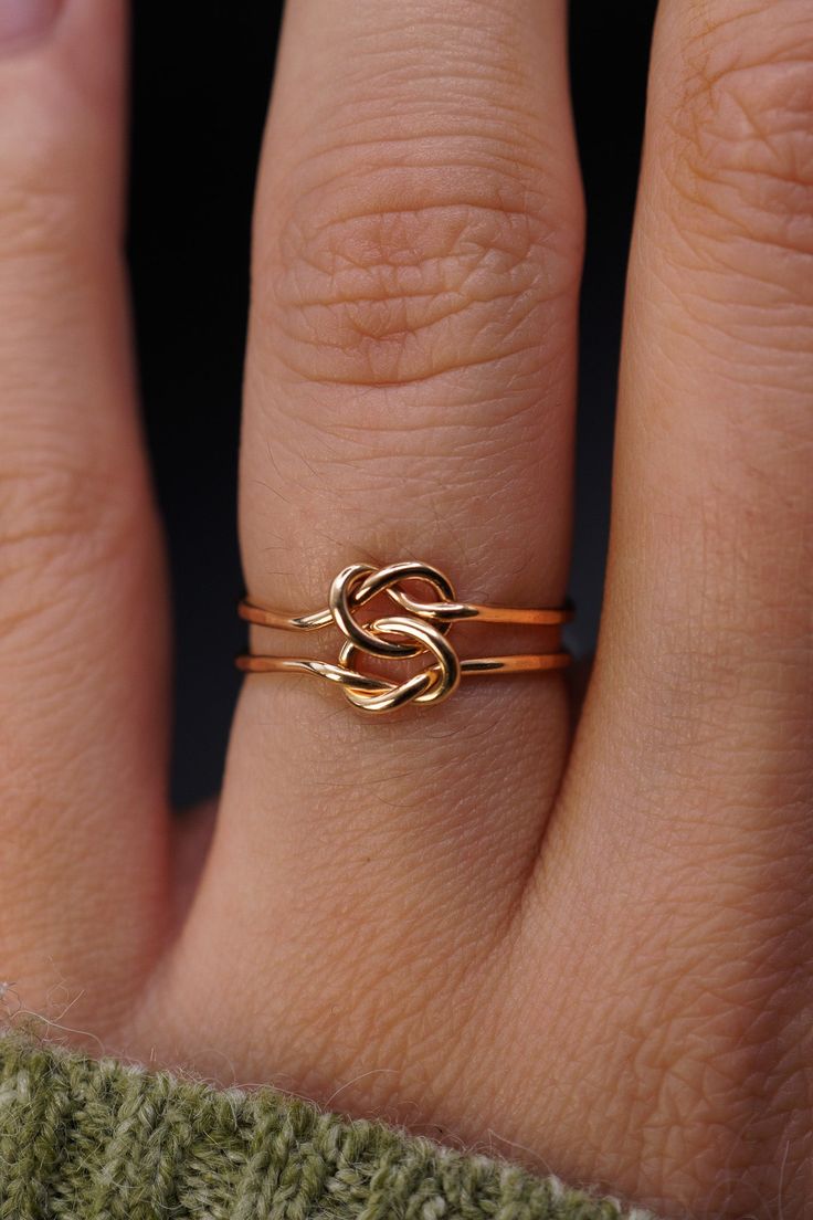 This double love-knot is the perfect gift! Made up of two individual rings that are permanently connected, this tied ring is a classic and gorgeous gift to symbolize your loved one. This listing is for ONE RING. Each ring is made from 14K GOLD FILL. Available only in the Thick (1mm) metal. Please note that the Open Knot Ring style has a slightly faceted or hammered finish. It is not completely smooth. Every piece is organic and unique — no two Hannah Naomi pieces are exactly alike.Hand-crafted t Gold Infinity Ring, Love Knot Ring, Single Ring, Infinity Ring, Knot Ring, Love Knot, Ring Style, One Ring, Gorgeous Gift