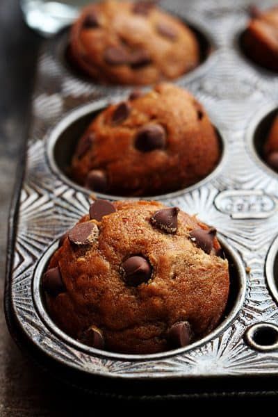 chocolate chip muffins in a metal pan on a table