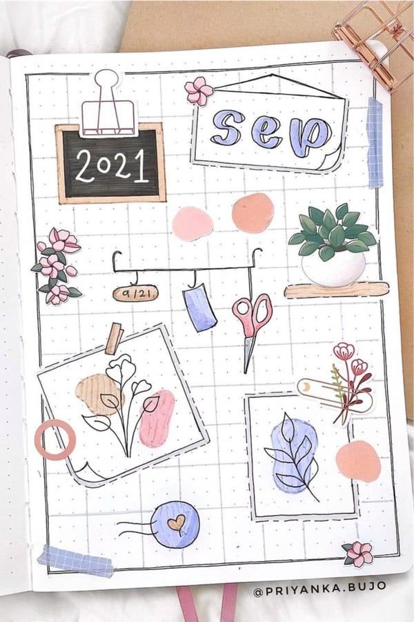 a notebook with some drawings on it and a clipboard attached to the cover that says sep