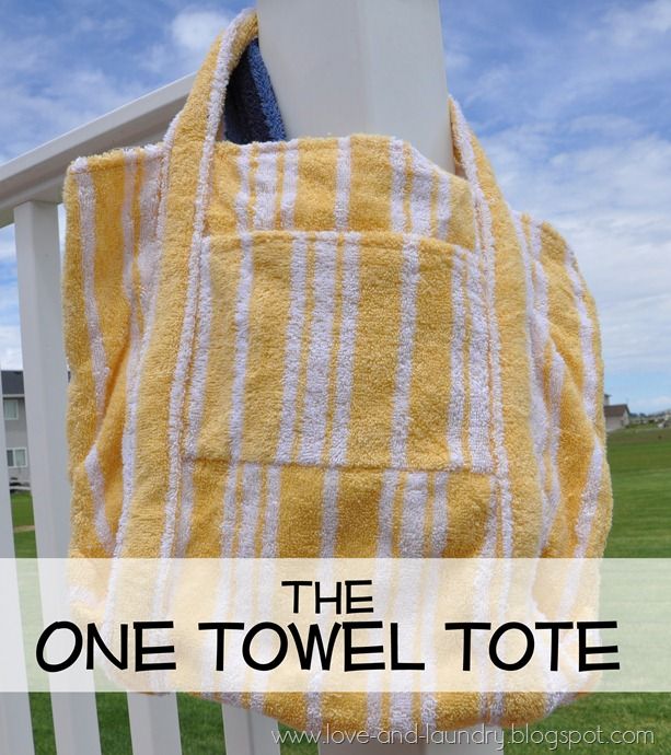 a yellow and white towel hanging on the side of a wooden fence with text overlay that reads, the one towel tote