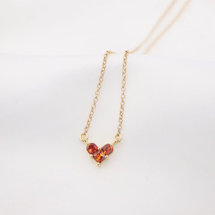 Dainty ruby heart shaped pendant necklace. Designed and handcrafted in our Burlington Studio. ------------------------------------------------------------- PRODUCTS DETAILS Pendant: 6X8mm Pendant: 14K gold plated cubic zirconia Chain and findings: 14K gold filled Total length (include pendant): 16"/18"/20"22" available from drop-down list, other length pls leave me a message for customization. Model: 16'' chain ------------------------------------------------------------- PACKAGE Gift packed: Je Gold Heart-shaped Birthstone Necklace, Gold Heart-shaped Birthstone Necklace With Gemstone, Gold Heart Cut Birthstone Necklace For Valentine's Day, Gold Birthstone Necklace With Heart Cut For Valentine's Day, Gold Heart-shaped 14k Gold Birthstone Necklace, Gold Heart Cut Birthstone Necklace As Gift, Gold Heart Cut Birthstone Necklace For Gift, Heart Shaped Pendant Necklace, Ruby Heart