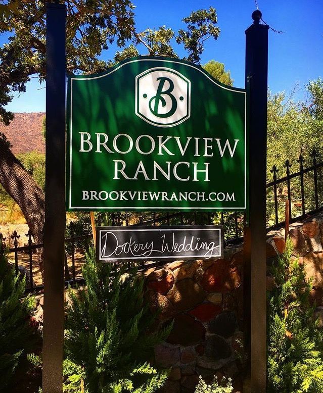 the sign for brookview ranch is surrounded by trees