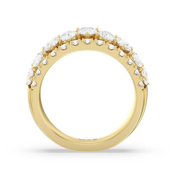 a yellow gold ring with three rows of diamonds