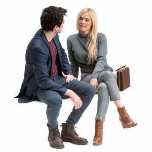 a man sitting next to a woman on a white background with a book in her lap