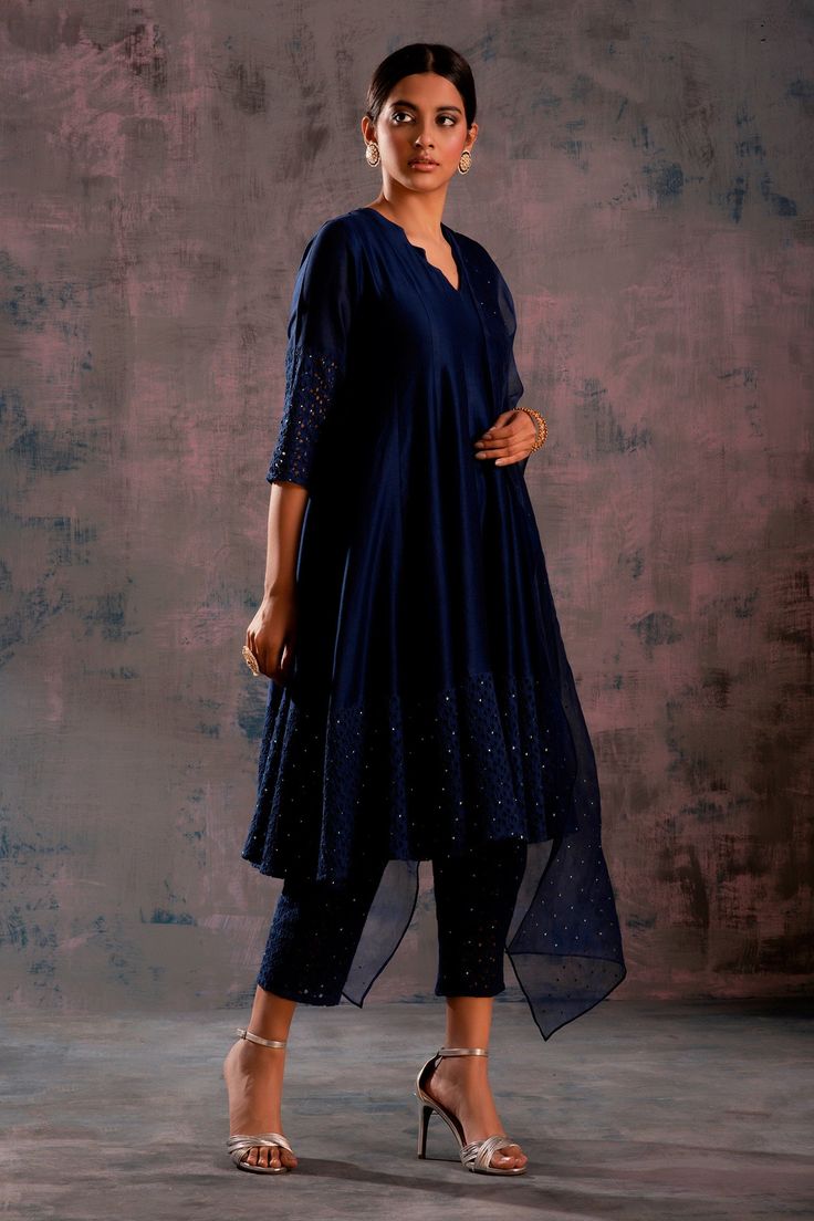 Midnight blue anarkali with cutwork motifs, Swarovski embroidered bodice and sleeves. Paired with cutwork, Swarovski embroidered pant and organza dupatta.
Component: 3
Embroidered
Neckline: Jagged neck
Sleeve Length: Three quarter
Fabric: Anarkali: Chanderi and Cotton, Pant: Cotton, Dupatta: Organza
Color: Blue
Cutwork motifs
Swarovski embroidered dupatta - Aza Fashions Blue Anarkali, Blue Kurta, Embroidered Anarkali, Kurta For Women, Embroidered Bodice, Cotton Dupatta, Embroidered Pants, Embroidered Dupatta, Organza Dupatta