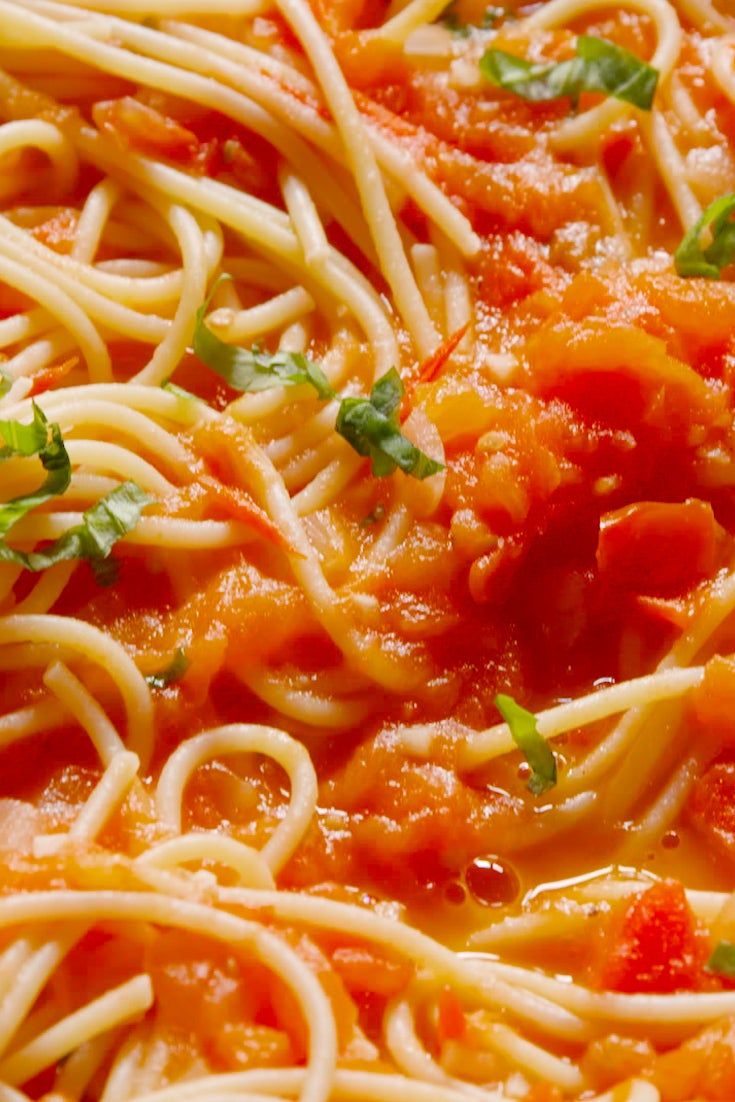 pasta with tomato sauce and parsley on top