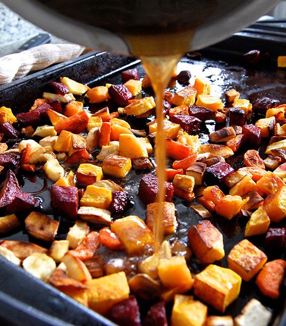 the food is being poured onto the pan