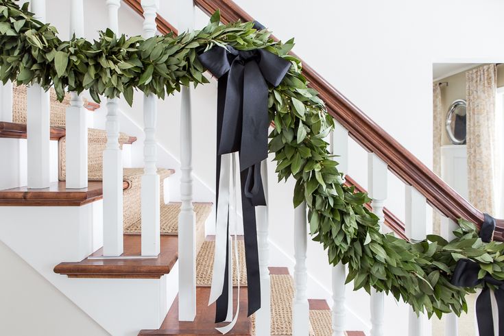 the garland on the banisters is decorated with greenery