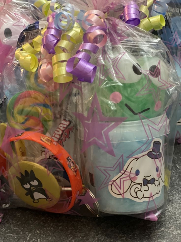 plastic cups and other items are wrapped in cellophane to look like cartoon characters