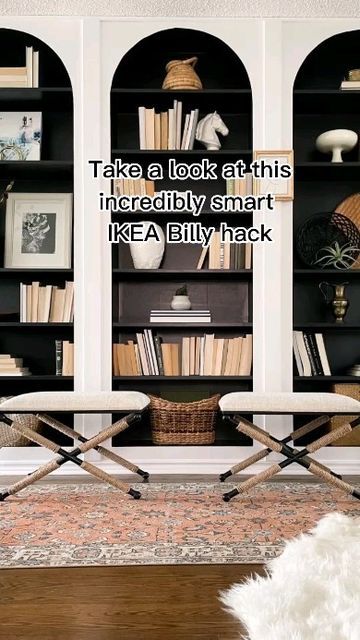 a living room filled with furniture and bookshelves next to a white dog laying on the floor