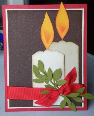 a close up of a card with a candle