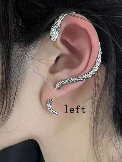 a woman's ear is shown with an intricate design on it