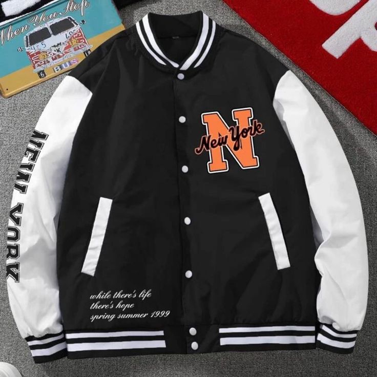 Never Worn! Trendy Black Varsity Jacket With Pockets, Black Outerwear With Pockets For College, College Style Black Outerwear With Pockets, Casual Oversized Black Varsity Jacket, Black College Style Varsity Jacket With Pockets, Black Oversized Outerwear For College, White Varsity Jacket With Contrast Color, Black Letter Print College Style Outerwear, Black Letter Print Outerwear College Style