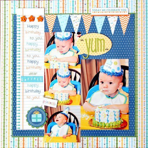 a scrapbook page with an image of a baby's first birthday cake and the words yum on it