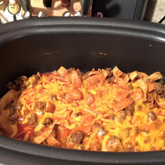 a close up of a casserole dish in a crock pot on a table