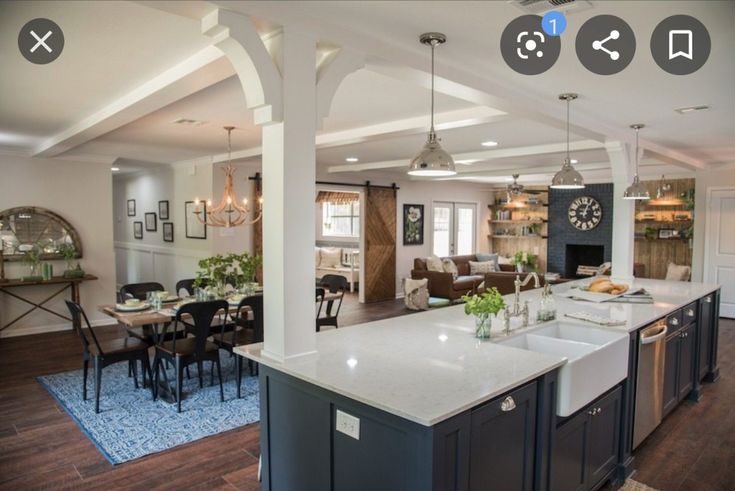 a large kitchen with an island in the middle and lots of counter space on each side