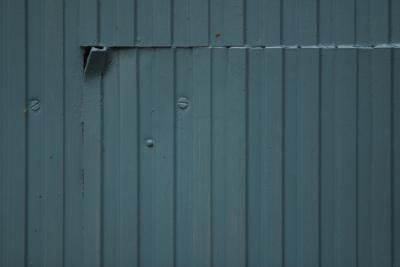 the side of a building that has been painted blue