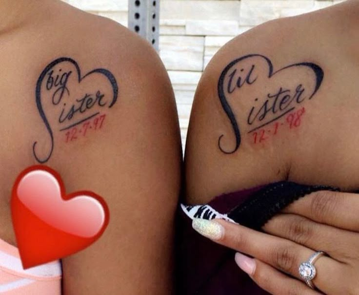 two women with tattoos on their arms and one has a red heart in the middle