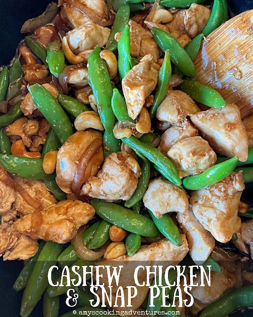 cashew chicken and snap peas stir fry in a wok