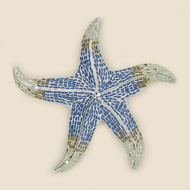 a blue and white mosaic starfish on a beige background