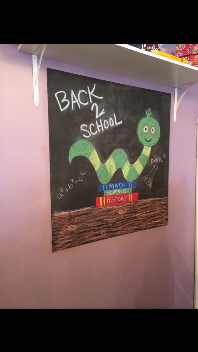 the back to school chalkboard is hanging on the wall in the children's room