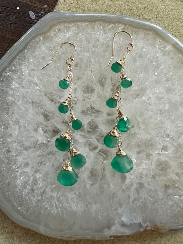 14kt gold filled ear hooks and chains with graduated green onyx briolettes, 2" (see Cleo style for similar options in other colors )This green is one of a kind for fall 2022 & see pics for other green onyx styles to compliment Other green styles shown in this image set are the Jetty punch in green onyx, the Love dangles, the margaret and Mini Gemma all in green onyx Colored Gemstones, Fall 2022, Green Onyx, Ear Hook, 14kt Gold, Green Fashion, Gemstone Colors, Gold Filled, Onyx