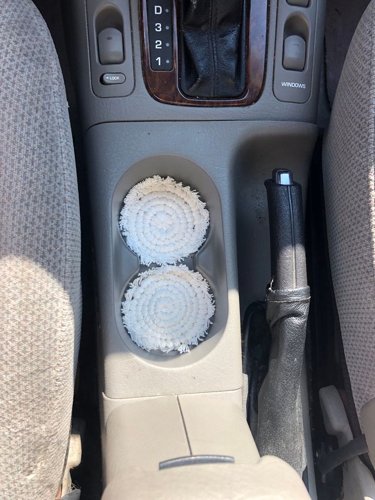 the interior of a car with two air freshener dispensers in it