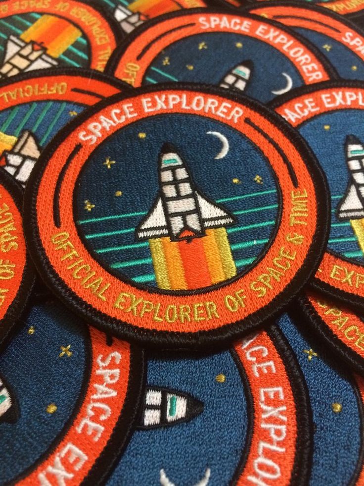 space explorer patches are arranged on top of each other in this close up photo,