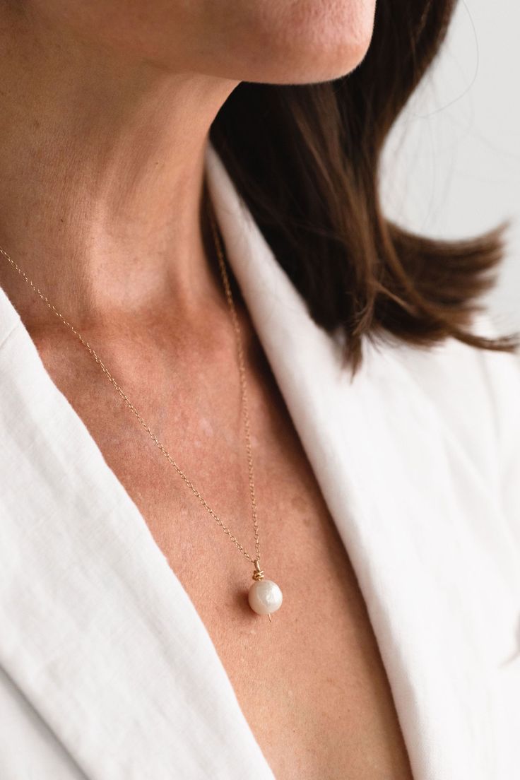 Simple and subtle elegance. The Baroque Pearl Necklace is set in a way to accentuate the quality and individuality of each pearl. Shaped by nature, no two of these pearls are ever the same. Please note that each pearl is unique in shape and size and will vary slightly, though will be true to the spirit of what is pictured. Delicate 14k gold fill chain Approximately 9-13mm Baroque Pearl Timeless Pearl Drop Necklace As Gift, Elegant Everyday Akoya Pearl Necklace, Elegant Single Strand Pearl Necklace, Timeless Pearl Drop Necklace For Anniversary, Timeless Pearl Necklace As Gift, Timeless Pearl White Necklace As Gift, Delicate Everyday Pearl Necklace With Pendant, Timeless Pearl Necklace For Gift, Timeless Everyday Pearl Necklaces