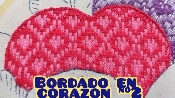 a close up of a red heart on top of a white background with the words bordao el cora in spanish