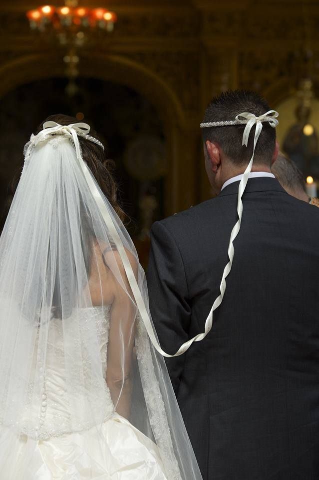 a bride and groom walking down the aisle